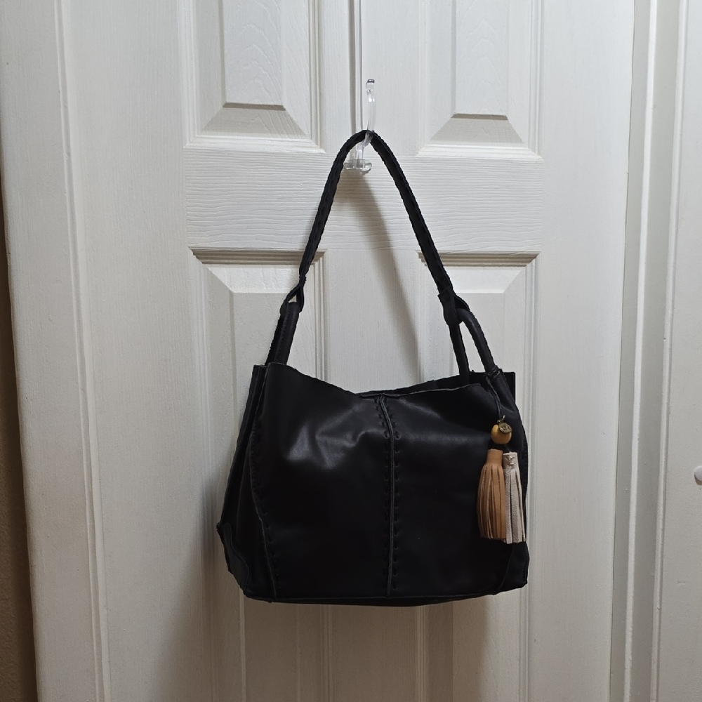 The Sak Black Shoulder Bag with Slouchy Design and Tassel Accent